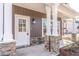 Covered front porch showing craftsman style columns with stone bases and address at 6935 Old Jefferson Hwy, Cameron, NC 28326