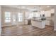 Open concept kitchen with stainless steel appliances, granite countertops, and large island at 6935 Old Jefferson Hwy, Cameron, NC 28326