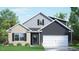 Charming two-story home with a brick and siding exterior, attached two-car garage, and well-manicured lawn at 7565 Percussion Dr, Apex, NC 27539
