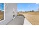 View of the backyard featuring a concrete patio and expansive lawn at 864 Forth Ct # 150, Gibsonville, NC 27249