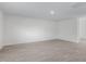 Spacious empty room with sleek floor and natural light at 864 Forth Ct # 150, Gibsonville, NC 27249