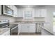 Modern kitchen featuring granite countertops, stainless steel appliances, and ample cabinet space at 864 Forth Ct # 150, Gibsonville, NC 27249