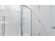 Modern bathroom with a glass enclosed walk-in shower with white tiling and silver trim at 864 Forth Ct # 150, Gibsonville, NC 27249