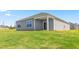 Exterior view of home with well maintained lawn and covered patio at 865 Forth Ct # 145, Gibsonville, NC 27249