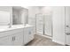 Modern bathroom with a double sink vanity and glass-enclosed shower at 865 Forth Ct # 145, Gibsonville, NC 27249