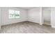 Well-lit bedroom with a large window and wood flooring at 865 Forth Ct # 145, Gibsonville, NC 27249