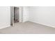 A bedroom with light-colored carpet and a closet at 865 Forth Ct # 145, Gibsonville, NC 27249