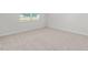 Bright bedroom with a large window and neutral carpet at 865 Forth Ct # 145, Gibsonville, NC 27249