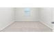 A bright bedroom with neutral carpet and a window with blinds at 865 Forth Ct # 145, Gibsonville, NC 27249