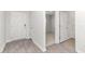 A welcoming entryway featuring durable wood-look floors and white trim details on the walls and doors at 865 Forth Ct # 145, Gibsonville, NC 27249