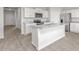Bright kitchen featuring an island with granite countertops and stainless steel appliances at 865 Forth Ct # 145, Gibsonville, NC 27249