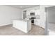 Bright kitchen featuring an island with granite countertops and stainless steel appliances at 865 Forth Ct # 145, Gibsonville, NC 27249