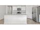 Bright kitchen featuring an island with granite countertops and stainless steel appliances at 865 Forth Ct # 145, Gibsonville, NC 27249
