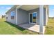 An open patio with sliding glass door and gray siding at 865 Forth Ct # 145, Gibsonville, NC 27249