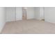 Large carpeted bedroom with two doors at 872 Forth Ct # 149, Gibsonville, NC 27249