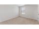 Bedroom with neutral carpet, bright window, and ample electrical outlets at 872 Forth Ct # 149, Gibsonville, NC 27249