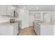 Well-equipped kitchen with a center island, stainless steel appliances, and grey cabinets at 872 Forth Ct # 149, Gibsonville, NC 27249