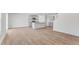 Spacious open-concept living area with wood flooring connected to the modern kitchen at 872 Forth Ct # 149, Gibsonville, NC 27249