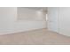 Carpeted loft area with a door, railing and a view to the first floor at 872 Forth Ct # 149, Gibsonville, NC 27249