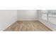 Well-lit, open room with hardwood flooring and neutral paint at 872 Forth Ct # 149, Gibsonville, NC 27249