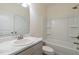 Bright bathroom featuring a marble countertop vanity and a white shower-tub combo at 88 E Victory View Ter, Smithfield, NC 27577