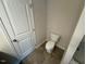Toilet with white walls and light colored flooring at 88 E Victory View Ter, Smithfield, NC 27577
