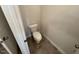 Well-lit powder room with a standard toilet and tiled flooring at 88 E Victory View Ter, Smithfield, NC 27577