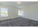 Bright bedroom with natural light, two windows, carpet flooring, and neutral walls at 88 E Victory View Ter, Smithfield, NC 27577
