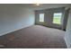 Spacious carpeted bedroom with natural light from two windows, creating a cozy atmosphere at 88 E Victory View Ter, Smithfield, NC 27577