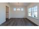 Bright dining room featuring a modern chandelier, laminate floors, and lots of natural light at 88 E Victory View Ter, Smithfield, NC 27577