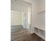 Hallway featuring an open doorway and a built-in bench with storage at 88 E Victory View Ter, Smithfield, NC 27577
