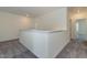 Hallway with neutral walls and carpet flooring features access to rooms and bathrooms at 88 E Victory View Ter, Smithfield, NC 27577