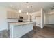 Kitchen featuring an island, pendant lights, granite countertops, and stainless steel appliances at 88 E Victory View Ter, Smithfield, NC 27577