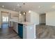 Kitchen featuring an island with pendant lights, granite countertops, and stainless steel appliances at 88 E Victory View Ter, Smithfield, NC 27577