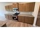 Kitchen featuring granite counters, stainless appliances, and wooden cabinets at 88 E Victory View Ter, Smithfield, NC 27577