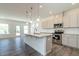 Charming kitchen boasts stainless appliances, granite countertops, and a center island with pendant lighting at 88 E Victory View Ter, Smithfield, NC 27577