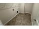 Laundry room with tile flooring, electrical boxes, and wire rack shelving at 88 E Victory View Ter, Smithfield, NC 27577