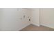 A functional laundry room featuring tile floors and washer/dryer hookups at 88 E Victory View Ter, Smithfield, NC 27577