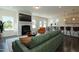 Inviting living room with a fireplace, open floor plan, and views into the dining area at 88 E Victory View Ter, Smithfield, NC 27577