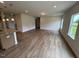 Spacious living room with wood floors and natural light from large windows at 88 E Victory View Ter, Smithfield, NC 27577