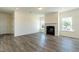 Inviting living room featuring a classic fireplace and plenty of natural light at 88 E Victory View Ter, Smithfield, NC 27577