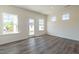 Bright living room with large windows and a door to the outside at 88 E Victory View Ter, Smithfield, NC 27577