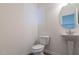 Small powder room featuring a pedestal sink and toilet at 88 E Victory View Ter, Smithfield, NC 27577