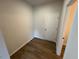 This is an empty room featuring hardwood flooring and a white door at 88 E Victory View Ter, Smithfield, NC 27577