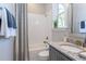 Cozy bathroom featuring a tub and shower, complemented by a gray vanity at 0 Old Middlesex Rd Rd, Middlesex, NC 27557
