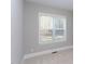 Bright bedroom featuring a window with white blinds and neutral carpet at 0 Old Middlesex Rd Rd, Middlesex, NC 27557
