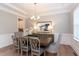 Elegant dining room with tray ceiling, hardwood floors, and stylish chandelier at 0 Old Middlesex Rd Rd, Middlesex, NC 27557