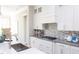 Well-lit kitchen with island, granite countertops, stainless steel appliances, and custom backsplash at 0 Old Middlesex Rd Rd, Middlesex, NC 27557