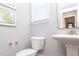 Bright powder room with pedestal sink, decorative mirror, and modern fixtures at 0 Old Middlesex Rd Rd, Middlesex, NC 27557