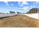 Expansive backyard features a white fence, offering privacy and space for outdoor activities at 1004 Bridgewater Dr, Durham, NC 27704